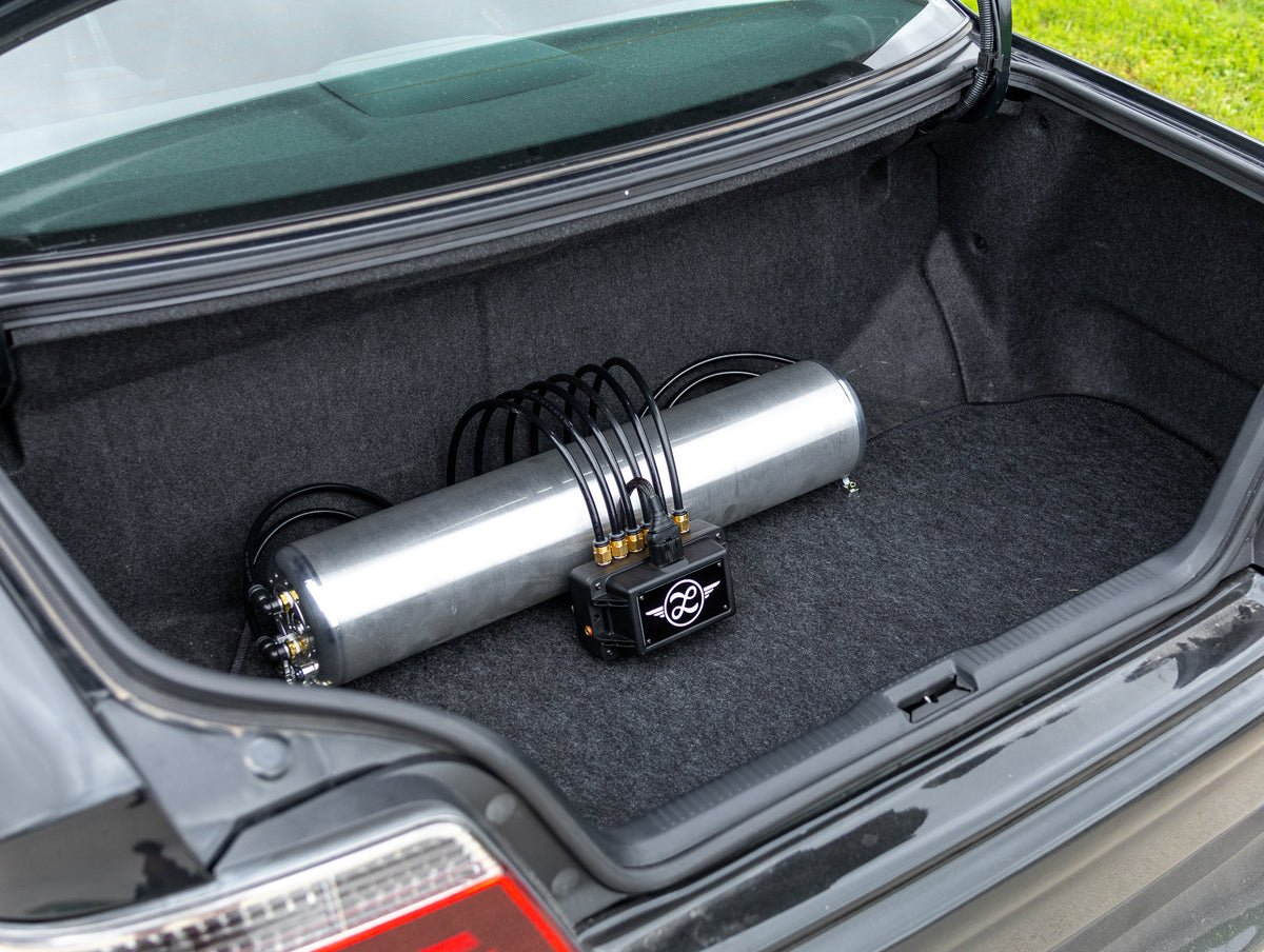Air suspension tank and management installation in black sedan
