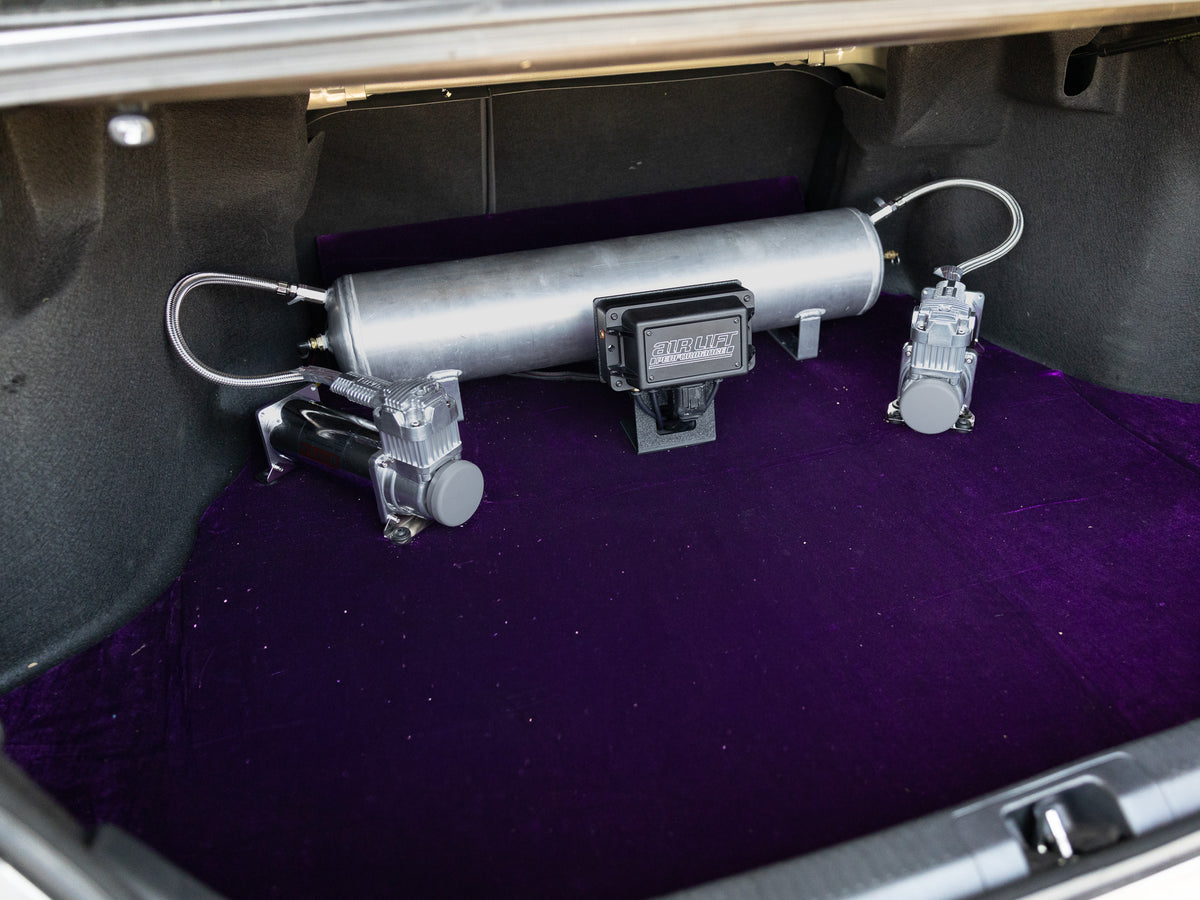 Custom dual compressor air suspension management setup in trunk