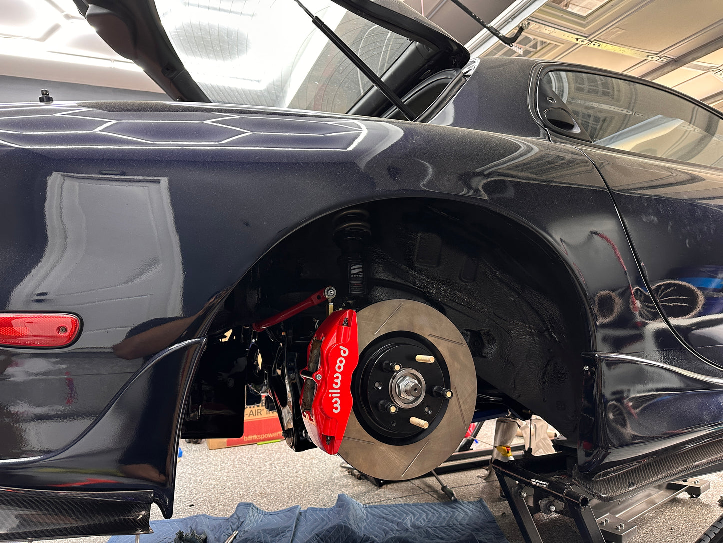 Mazda RX-7 FD3S rear Wilwood Superlite brake setup with RX-8 Sport rotor and BBK adapter installed
